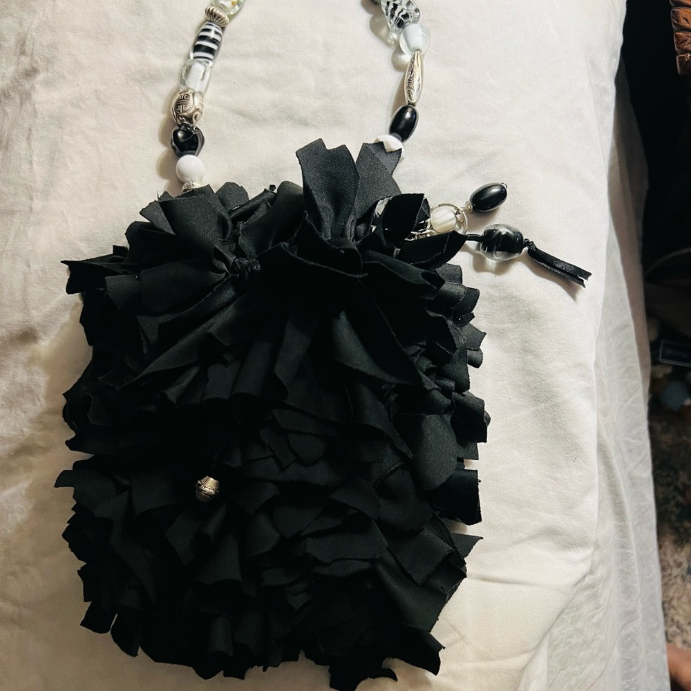 One of a kind very cute little purse. Unique.
